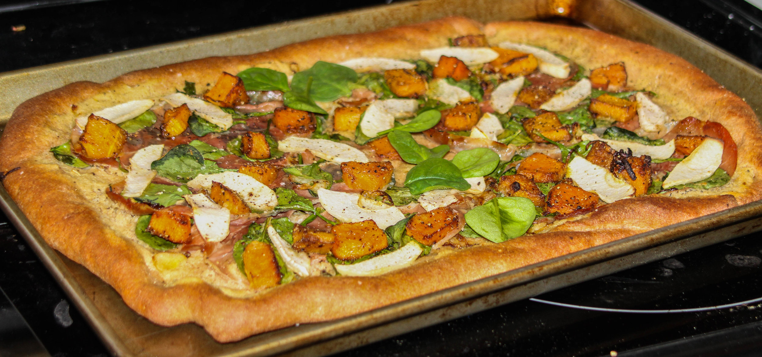 PIZZA WITH ROASTED SQUASH, CARAMELIZED ONIONS, AND APPLES